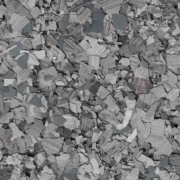 A textured grayscale image depicting a pile of assorted, broken pieces resembling rocks or construction debris, with varying shades of gray.