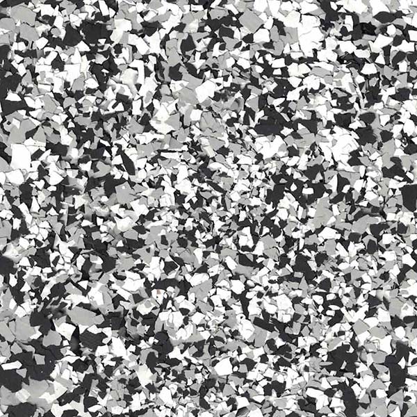 The image displays a chaotic aggregation of monochromatic, irregularly-shaped particles resembling crushed pieces of various gray scales, creating a textured abstract appearance.