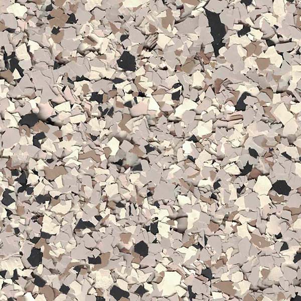 This image shows a texture comprising varied shapes and shades of beige, tan, and black, resembling a close-up view of a speckled surface or material.