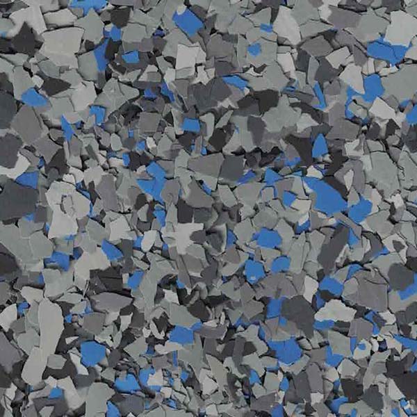 The image is a close-up of numerous scattered, irregular-shaped fragments in varying shades of gray and blue, seemingly resembling broken materials or rubble.
